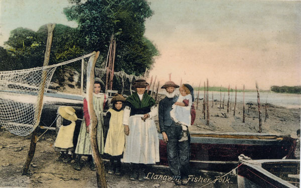 Undated copy of a photograph Llangwm Pembrokeshire fisher folk unnamed possibly the Morgan family standing on the fore shore